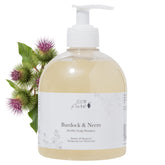 100% PURE Burdock & Neem shampoo bottle pour for easy distribution and cleansing