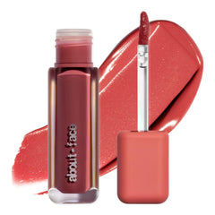 About-Face Blur Matte Lip Plump swatch in Rosy Peach shows soft, hydrated color.