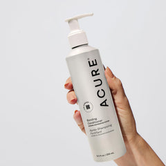 Avocado oil label detail signals deep nourishment for dry, damaged ends.