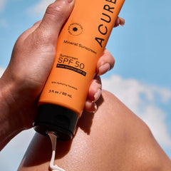 Body application of Acure sunscreen SPF 50 for outdoor protection