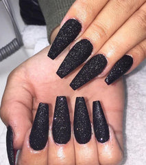 Aegenacess black coffin glitter nails for a salon-style look at home.