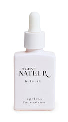 Agent Nateur Holi Oil bottle displays a nourishing serum for radiant skin.