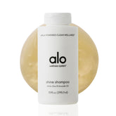 Alo Shine Shampoo bottle with glossy finish for smooth, frizz-free hair.