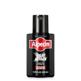 Alpecin Gray Attack bottle being poured showing gradual gray coverage thanks to caffeine care.