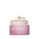 Alpyn Beauty Line-Filling Eye Balm applied under the eye for a refreshed look.