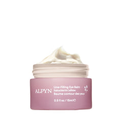 Alpyn Beauty Line-Filling Eye Balm applied under the eye for a refreshed look.