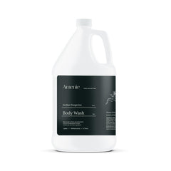 Amenie Sicilian Tangerine Body Wash bottle offers spa-like cleansing for hotel bathrooms.