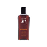 American Crew Daily Moisturizing Shampoo bottle on sink for daily cleansing and hydration.