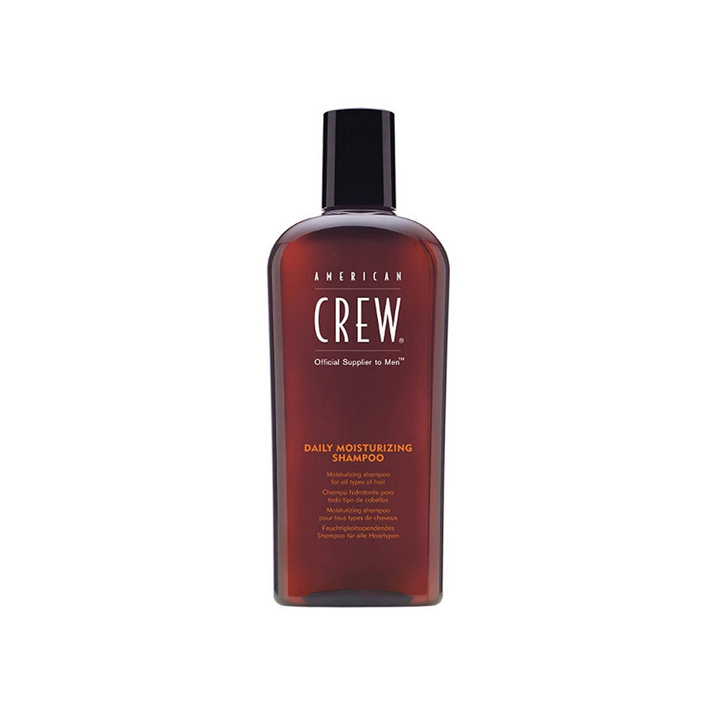 American Crew moisturizing shampoo bottle pouring to show daily cleansing and fresh citrus-mint aroma.
