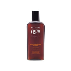 American Crew moisturizing shampoo bottle pouring to show daily cleansing and fresh citrus-mint aroma.