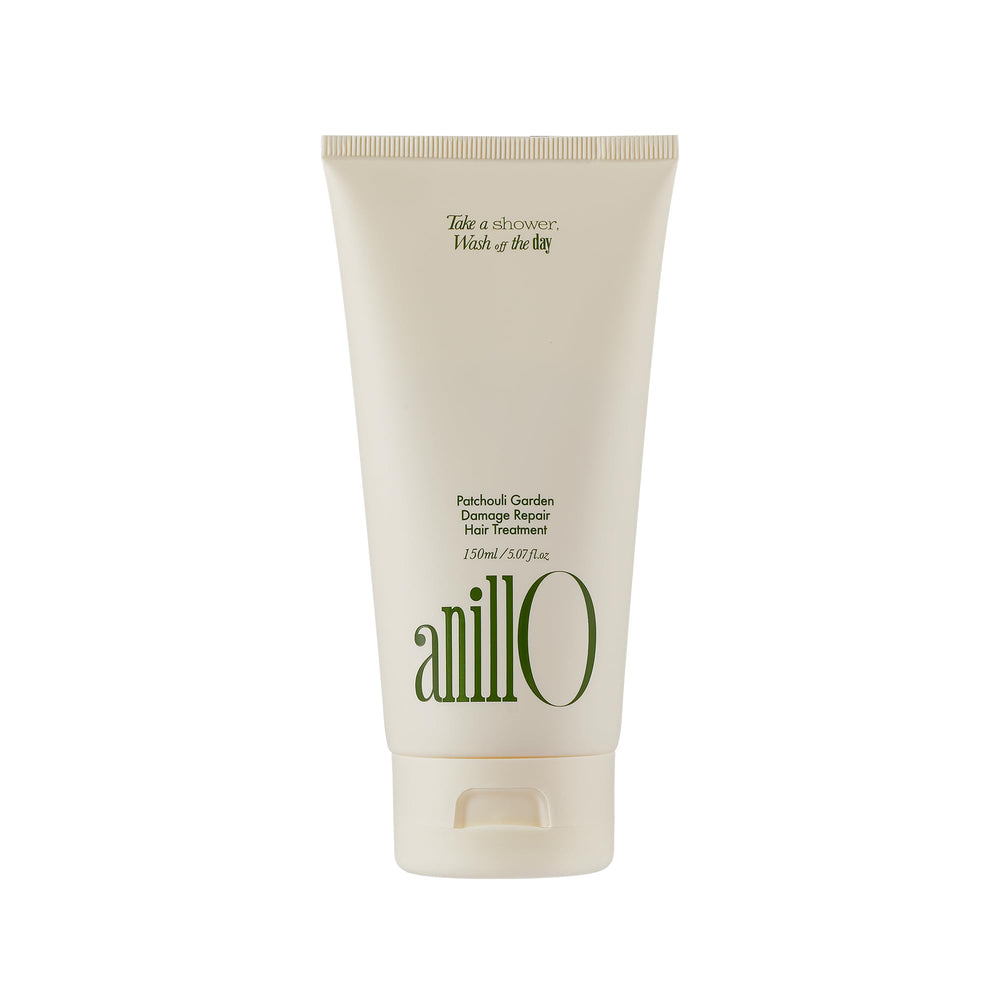 ANILLO Patchouli Garden hair mask bottle being poured for nourishing treatment of damaged hair