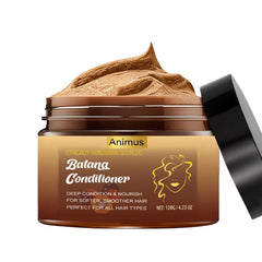 Animus Batana Oil bottle pour showing root nourishment and natural shine.