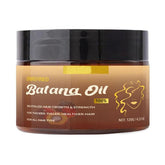 Apolo Batana Oil bottle pouring for deep hair nourishment and scalp hydration.