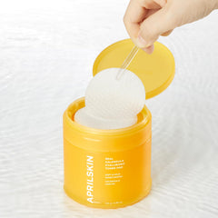 APRILSKIN Calendula PHA Hyaluronic Toner Pads on tabletop opened for skincare ritual.