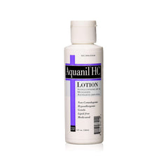 Aquanil HC Lotion bottle closeup shows fragrance-free medicated formula for sensitive skin.