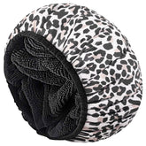 Aquior leopard shower cap exterior satin finish keeps hair dry during showers.
