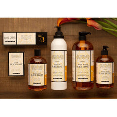 Archipelago Black Honey Lotion being massaged into hands for absorption.