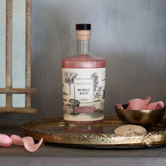 Archipelago Botanicals Charcoal Rose Bubble Bath bottle ready for a relaxing soak.