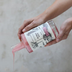 Archipelago Botanicals Charcoal Rose Bubble Bath close-up shows charcoal powder.