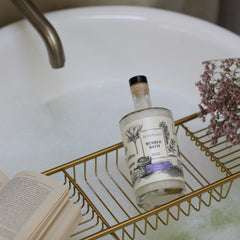 Archipelago Botanicals Lavender Bubble Bath with lavender sprigs evokes soothing aromatherapy.
