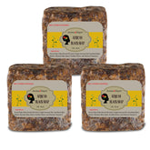 Aroma Depot raw African black soap bar on wood surface for everyday cleansing.