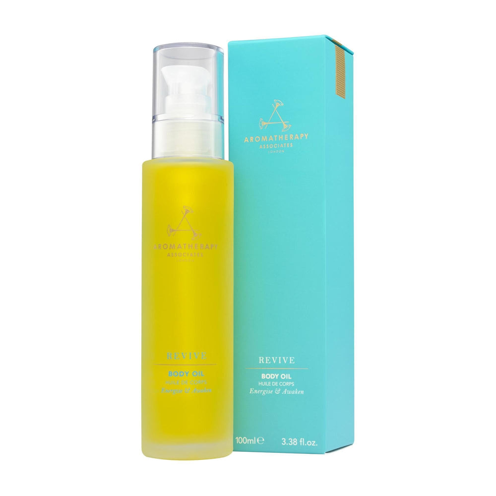 Aromatherapy Associates Revive Body Oil bottle on shelf for energizing skin ritual