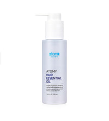 A.t.o.m.y Hair Essential Oil bottle with pump delivers lightweight anti-frizz shine.