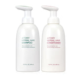 A.t.o.m.y Herbal Shampoo bottle close-up for a nourishing cleanse of hair and body.