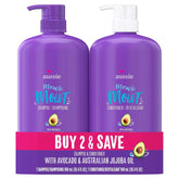 Aussie Miracle Moist shampoo bottle with citrus scent delivering deep hydration.
