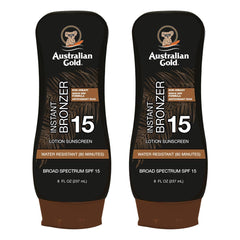 Australian Gold SPF 15 Lotion Bronzer twin-pack bottle close-up with instant bronze tint