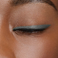 AVON Glimmerstick Eyeliner Saturn Grey waterline application for bold, smudge-resistant eyes.