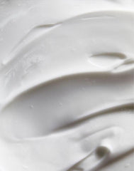Closeup of AVON Solutions cream texture, rich emollients for dry skin.