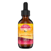 Bali Aga Kemiri Oil bottle closeup for nourishing hair and split end care.