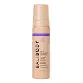 Bali Body Deep Violet Mousse bottle closeup shows rich, even color development for a natural tan.