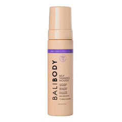 Bali Body Deep Violet Mousse bottle closeup shows rich, even color development for a natural tan.