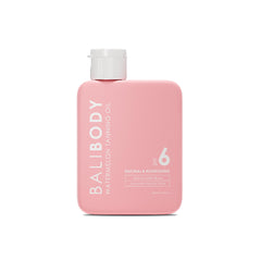 Bali Body Watermelon Tanning Oil SPF 6 bottle shown, offering light protection and bronze glow.