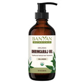 Banyan Botanicals Bhringaraj oil bottle for daily scalp nourishment.