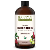 Banyan Botanicals Herbal Hair Oil bottle with nourishing formula for healthy hair
