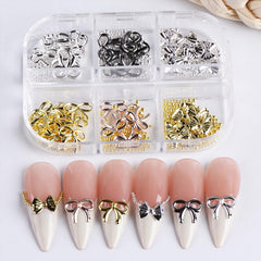 Baoyaalin silver bow nail charms shine on tips for festive looks.