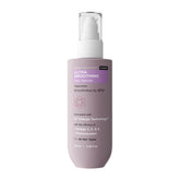 Bare Anatomy Ultra Smoothing Serum bottle being poured for smoother, hydrated hair