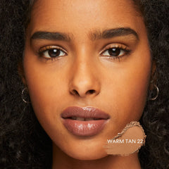Brush application scene highlights easy blending and light feel from Bare Minerals.