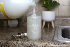 Hands washing with Bastion Pina Colada soap for moisture.