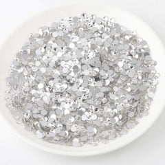 Beadsland nail art rhinestones shown with glue application for durable decoration.