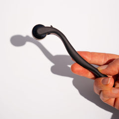 Beautimate microneedle derma roller used on scalp for targeted care.