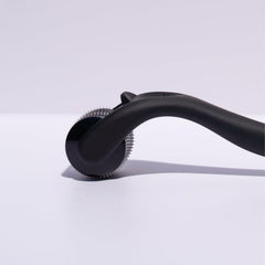 Beautimate microneedle derma roller on beard area for grooming.