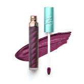 Beauty Bakerie Lip Whip Berried close-up shows vibrant matte color on skin.