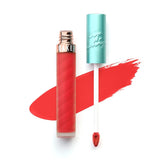 Beauty Bakerie Lip Whip bowl-of-cherries tube close-up showing vibrant color on lips.