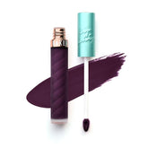 Beauty Bakerie Lip Whip She's Just Jelly close-up shows bold purple pigment and smooth texture.