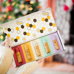 Bee Bella Lip Balm Pomegranate Mango offers tropical scent and protective moisture.