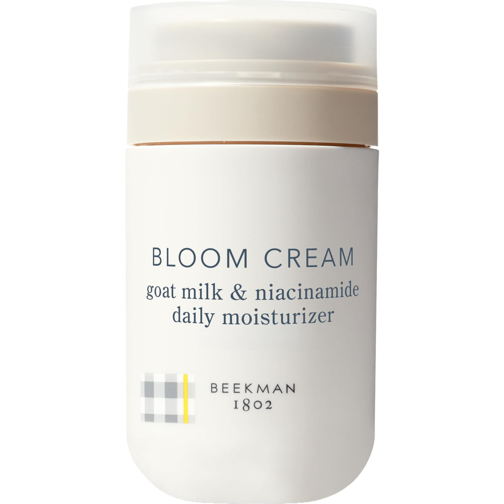Beekman 1802 Bloom Cream jar close-up shows silky hydration texture.